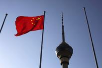 Economists See China Rate Rise Amid Slower Growth