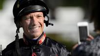 Dettori earns first win since return