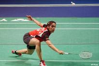 Saina beats Juan Gu to reach second round at Singapore