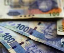 Rand firms as SARB holds rate