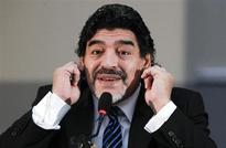 Maradona clashes with reporters on return home to Buenos Aires