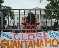 Obama and Heckler Plead to Close Gitmo