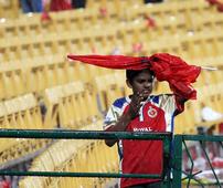 PIX: Fans frustrated as rain plays spoilsport in Bangalore