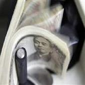 Japan's central bank says economy picking up