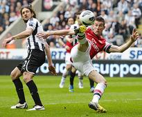 European soccer: Arsenal, Milan book Champions League berth