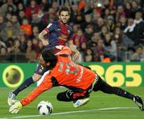Fabregas scores hat-trick as Abidal returns