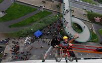 Wheelchair-bound man rappels down Prague building