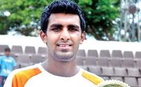 Prajnesh downs Malik to lift title