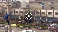 Drunk man climbs power lines in China