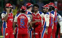 Bangalore pip gallant Delhi to stay in the knockout race