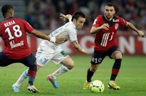 Marseille rely on strong defense in home straight