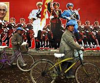 'India, China sometimes hold hands, sometimes race each other'
