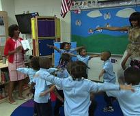 Video: Michelle Obama gets her groove on with school kids