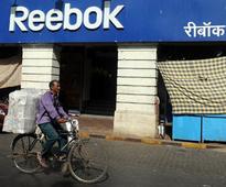 Former Reebok CFO may face action for not providing info