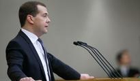 Putin praises 2012 government performace report