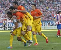 Barca celebrate title with Atletico comeback win