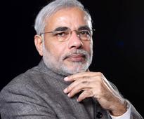 U'khand: Modi calls up Bahuguna, assures assistance
