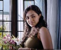 Tamil 22 Female Kottayam: Nithya Menon in Rima Kallingal shoes