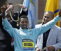 Boston Marathon winner gives championship medal to Boston