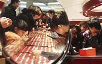 Gold erases gains after Bernanke comments