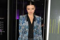 Miranda Kerr borrows husband's clothes