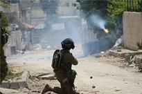 2 Palestinians injured as Israeli forces storm Hebron camp