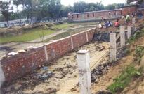 School pond being filled up to build market