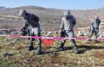 Chinese soldiers clear mines, win hearts