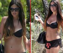 Italian model Claudia walks around Miami wearing nothing but a bikini (view pics)