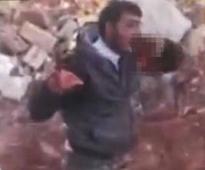 Syrian rebel shown eating soldier`s heart in a gruesome video
