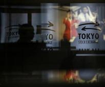 Asian stocks to lead to year's end, Fed seen pulling back: poll