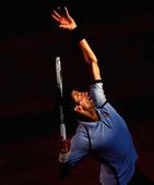 Djokovic through, Wozniacki out