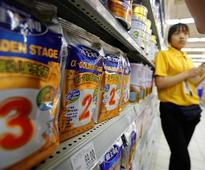 China milk powder firms court foreign cachet for domestic gains