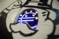 ECB cuts interest rates, open to further action