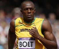 Bolt wins 100m in photo finish