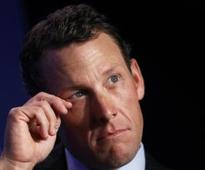 Armstrong quits swimming event