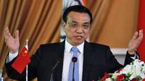 Li seeks to impress with 'namaste' informal style