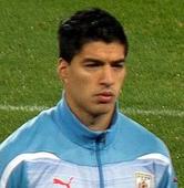 Liverpool's Suarez banned 10 games for biting, asks forgiveness