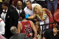 Bird-flipping Heat fan Filomena Tobias is sorry, sort of, for giving Joakim Noah the finger