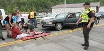 Up to 60 people injured when car drives into Va. parade; medical emergency possible cause